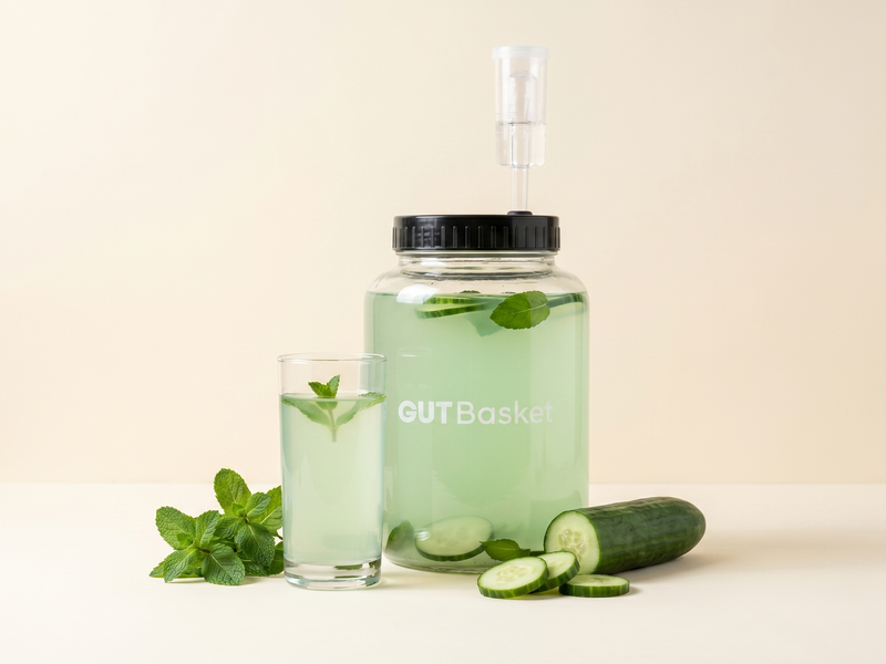 A glass of Cucumber-Mint Cooler, a probiotic fermented drink.