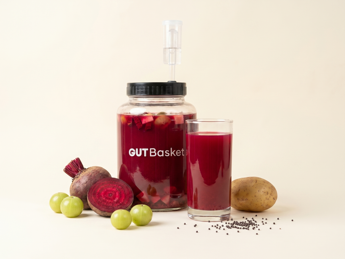 A jar of Beet, Amla & Potato Kanji, a traditional Indian lacto-fermented probiotic drink.
