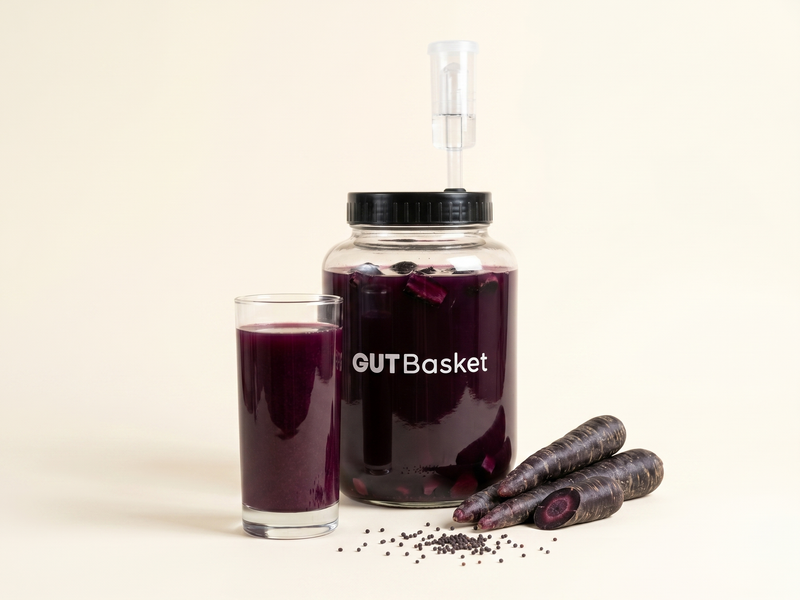 A jar of Black Carrot Kanji, a traditional Indian lacto-fermented probiotic drink.