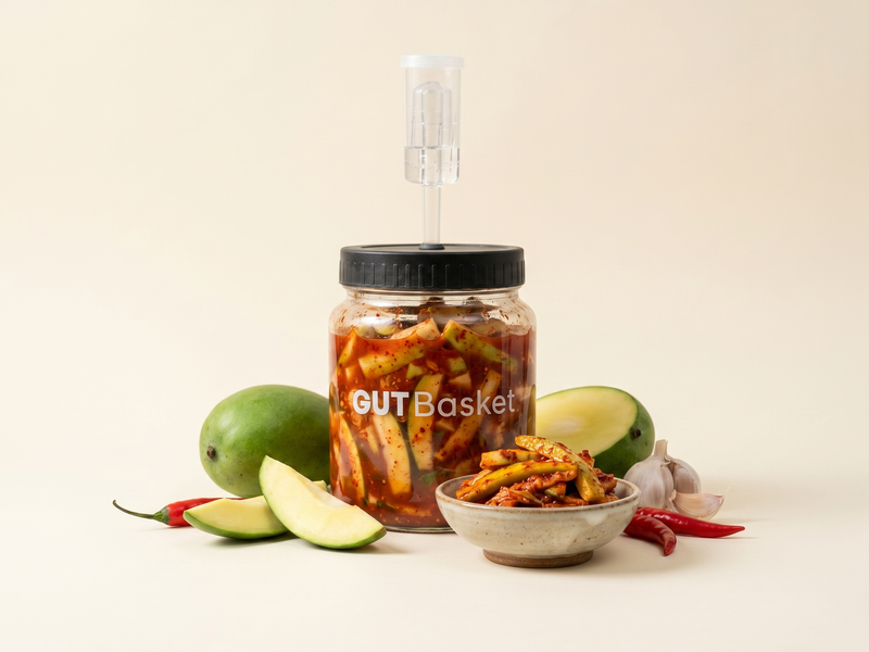 Raw Mango Kimchi (Mang-go Kimchi) - Korean-style lacto-fermented vegetables in a jar.